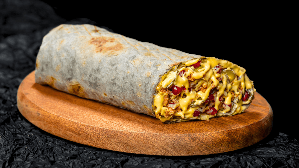 Cheddar Craft Shawarma cut open — the black lavash